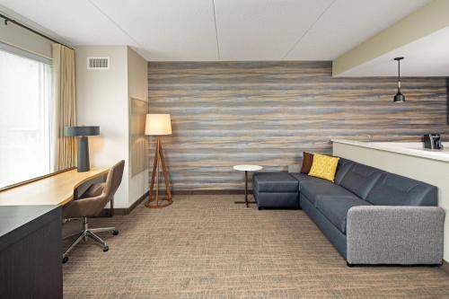 a living room with a couch and a table at Residence Inn by Marriott Toronto Mississauga West in Mississauga