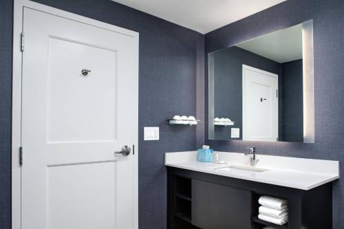 a bathroom with a sink and a mirror at Residence Inn by Marriott Toronto Mississauga West in Mississauga