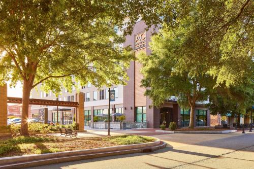 a view of a building with trees in front of it at AC Hotel by Marriott Columbus Downtown in Columbus