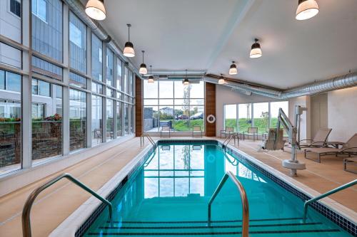 a swimming pool in a building with windows and a large pool at Element Spring Valley in Spring Valley