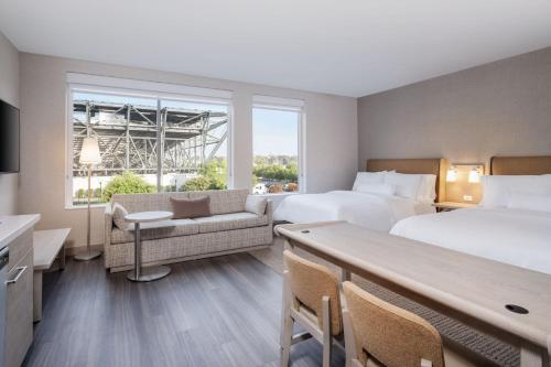 a hotel room with two beds and a large window at Element San Jose Airport in San Jose