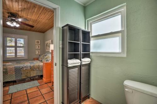 a bathroom with a room with a bed and a window at Palm Harbor Vacation Rental, Walk to Crystal Beach in Palm Harbor