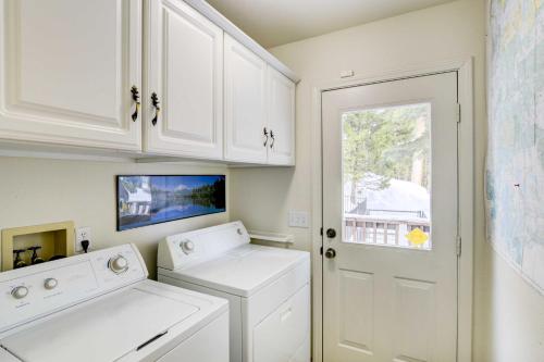 a white laundry room with a washer and dryer at Pet-Friendly California Cabin with Beach Access in Chester