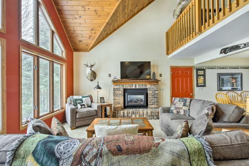 a living room filled with furniture and a fireplace at Fishing Haven Family Home on Indian Lake in Three Lakes