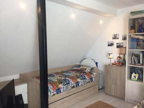 a bedroom with a bed and a mirror at Guadarrama, ático nuevo con espectaculares vistas in Guadarrama