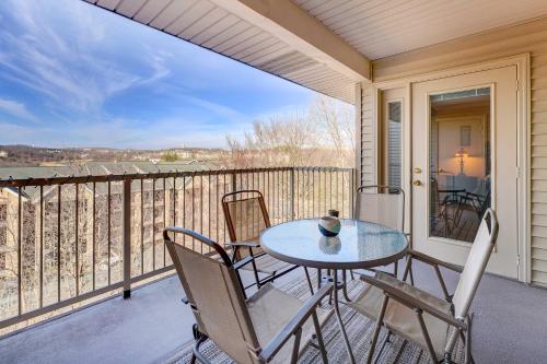 a patio with a table and chairs on a balcony at Branson Condo 1 Mi to Dolly Partons Stampede! in Branson