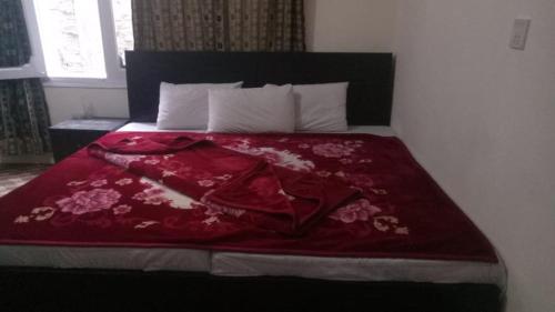 Postelja oz. postelje v sobi nastanitve Silver Gleam Hotel