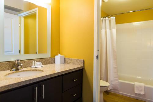 a bathroom with a sink and a toilet and a shower at TownePlace Suites by Marriott Lancaster in Lancaster