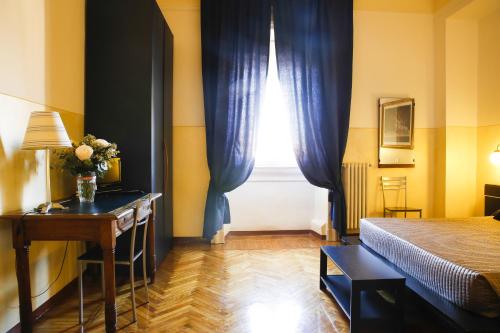 A bed or beds in a room at Albergo Garisenda