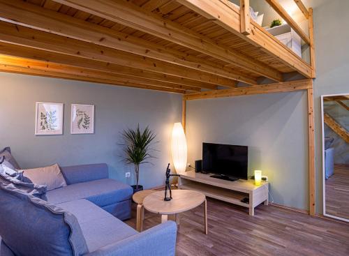 A television and/or entertainment centre at La Bella - Entire Apartment near Gozsdu udvar