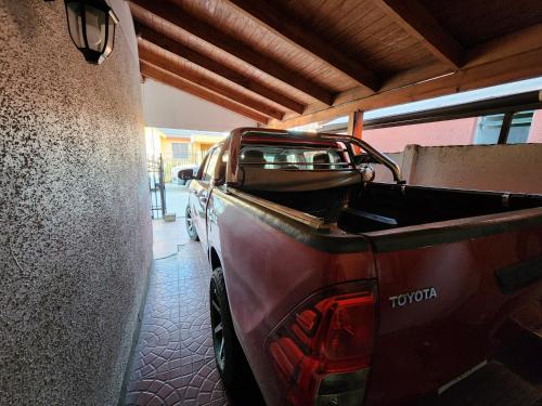 a truck parked in a garage with the back of it at Concepción - San Pedro de la Paz in San Pedro de la Paz
