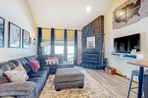 a living room with a couch and a fireplace at Durango Dreaming in Durango Mountain Resort