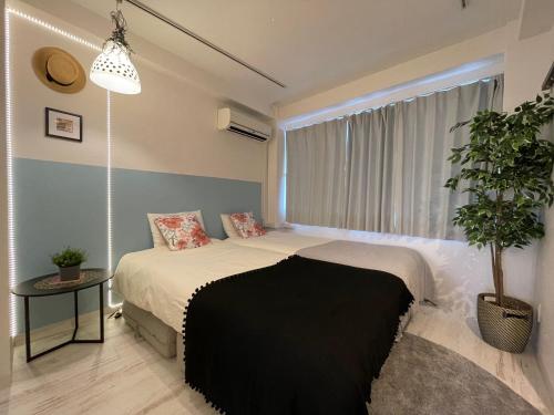Postel nebo postele na pokoji v ubytování Hotel Ougien