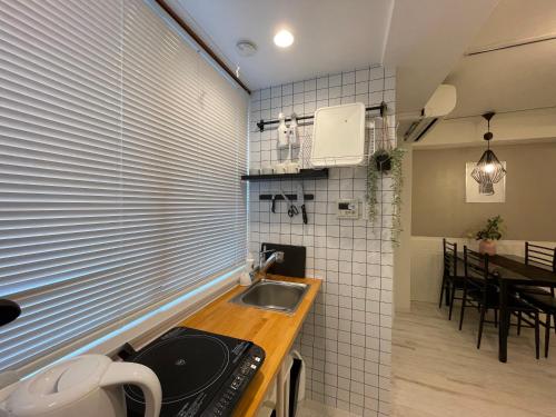 Kuchyň nebo kuchyňský kout v ubytování Hotel Ougien