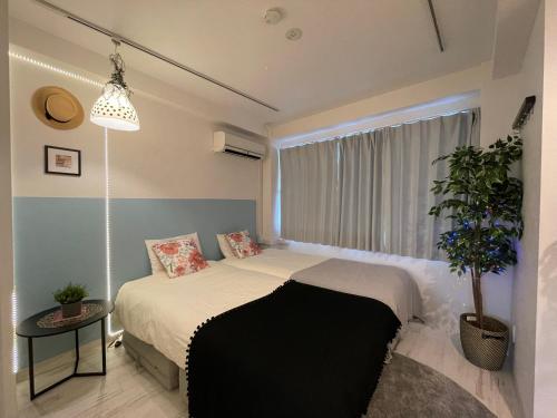Postel nebo postele na pokoji v ubytování Hotel Ougien