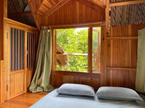 Кровать или кровати в номере Đà Lạt Củi Homestay