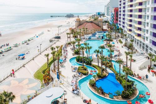 an aerial view of the pool and beach at a resort at Modern Beach Highrise-Ocean View-Jacuzzi-Walk In Shower At Ocean Walk Resort Daytona Beach in Daytona Beach