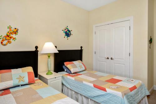 a bedroom with two beds next to each other at The Dunes in Oak Island