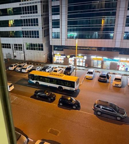a model of a city street with cars and a bus at MBZ - Cosy Separate Room in Unique Flat in Abu Dhabi