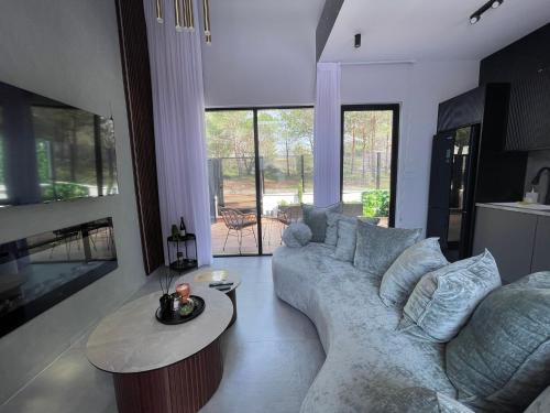 a living room with a couch and a table at Dian’s suits in Gita