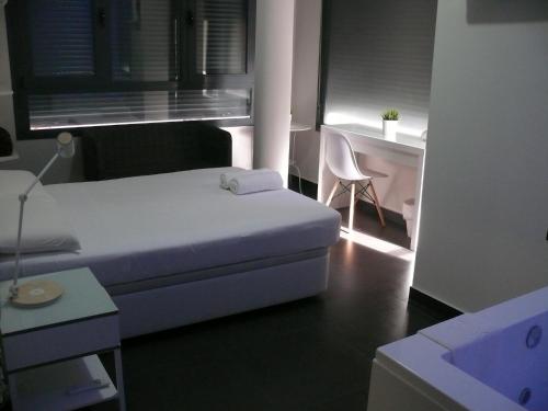 Posteľ alebo postele v izbe v ubytovaní HOSTAL LETTO DAL MARE