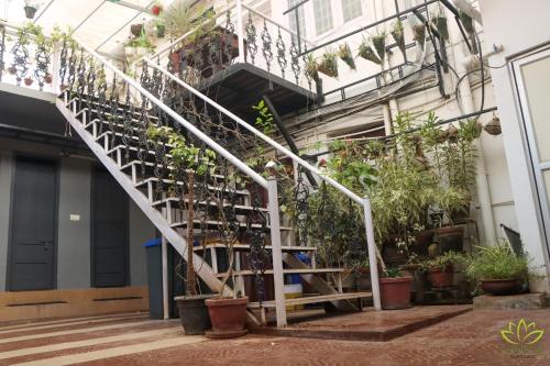 a staircase with plants on the side of a building at Aambal Residency in Cochin