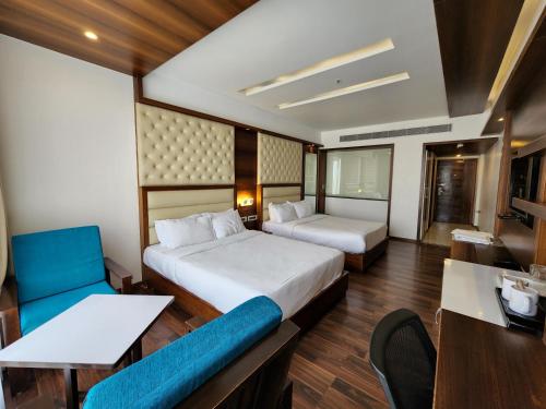 Postel nebo postele na pokoji v ubytování Hotel Preethi International