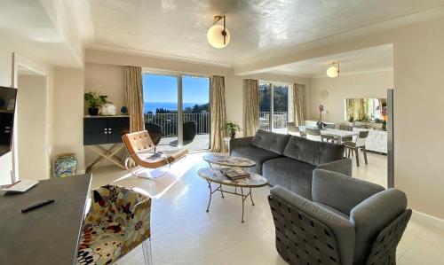 a living room with a couch and a table at Taormina Skyline in Taormina