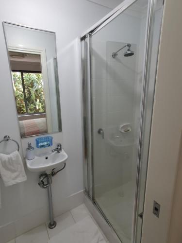 a bathroom with a shower and a sink at Sandalwood Guest Room in Margaret River Town