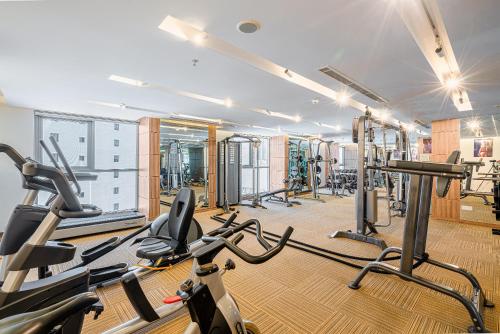 a gym with several treadmills and cardio machines at Libra Hotel Nha Trang in Nha Trang