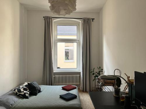 a bedroom with a bed and a window at Dreamy Apartment in Kreuzberg - 130m2 in Berlin