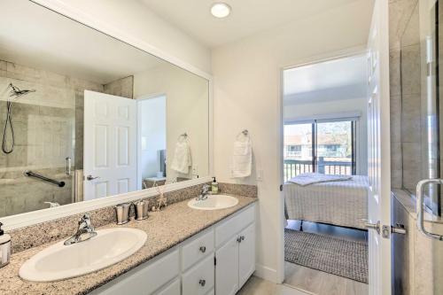 a bathroom with two sinks and a large mirror at Bright Townhome in Carlsbad 1 Mile to Beach! in Carlsbad