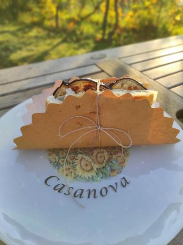 a cake sitting on a plate on a table at Podere Casanova in Montespertoli