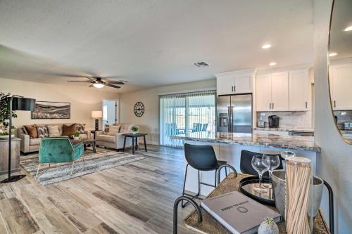 a kitchen and living room with a table and chairs at Golfers Haven! Gem with Patio and Grill in Sun City in Sun City