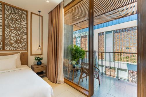 En eller flere senge i et værelse på Daisy Boutique Hotel