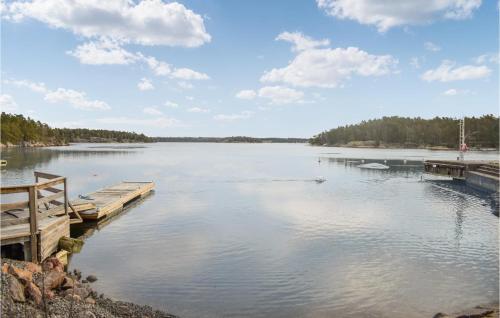 a view of a lake with a dock at Amazing Apartment In Figeholm With Wifi in Figeholm