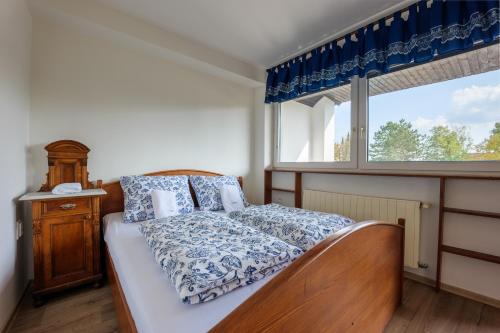 Tempat tidur dalam kamar di Penzion POSADA