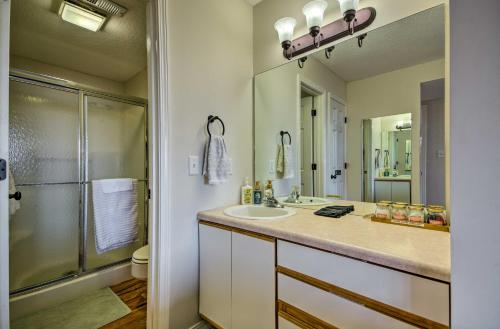 a bathroom with a sink and a shower at Ozarks Vacation Rental Condo with Lake View! in Lake Ozark