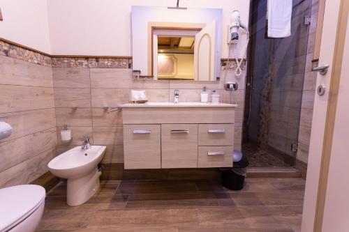 a bathroom with a sink and a toilet at Antica Piacenza in Piacenza