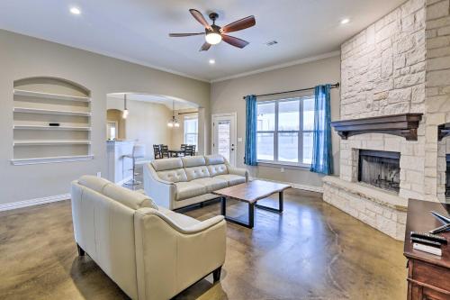 a living room with a couch and a fireplace at Secluded Krum Home with Patio and Gas Grill! in Krum