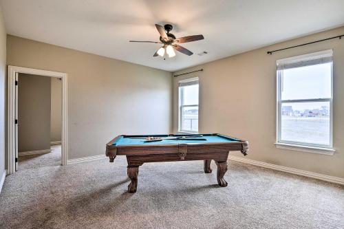 a pool table in a room with a ceiling fan at Secluded Krum Home with Patio and Gas Grill! in Krum
