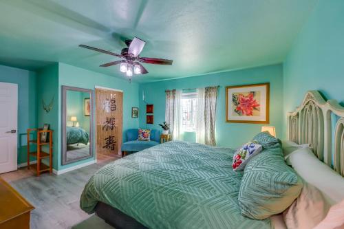 a bedroom with a bed and a ceiling fan at Payson Vacation Rental with Private Patio! in Payson
