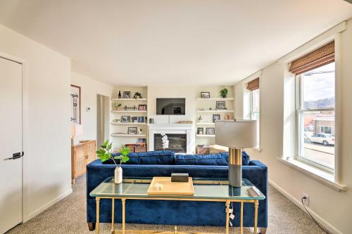 a living room with a blue couch and a table at Cincinnati Vacation Rental 6 Mi to Downtown! in Cincinnati