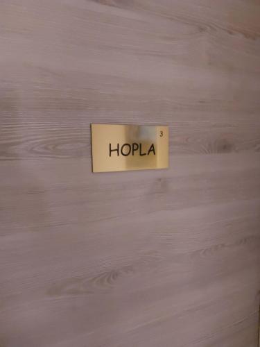 a sign that says honda on a wooden wall at Mirabelle Bed & Breakfast in Ribeauvillé