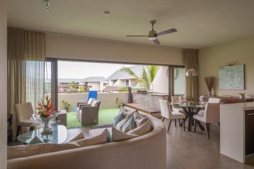 a living room with a couch and a table at SLEEP IN MAURITIUS in Grand Baie