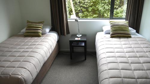 Postel nebo postele na pokoji v ubytování Darfield Motel