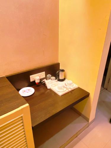 Ένα ή περισσότερα κρεβάτια σε δωμάτιο στο Status Business Hotel - Naveen Market