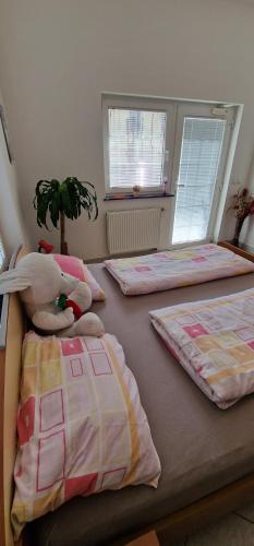 Postel nebo postele na pokoji v ubytování Apartman MURKO P-1