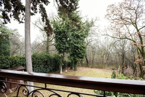a view of a park from a bench at Hilltop Wellness Villa-big garden, sauna, hot tube in Pécs