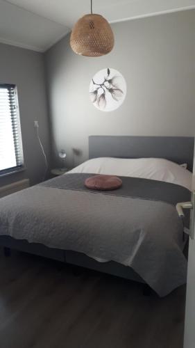 Ένα ή περισσότερα κρεβάτια σε δωμάτιο στο Vakantiehuis